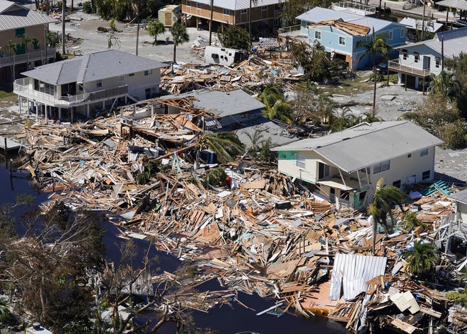 Homes and businesses are devastated after Hurricane Ian on Friday, Sept. 30, 2022, on Fort Myers Beach, Fla.