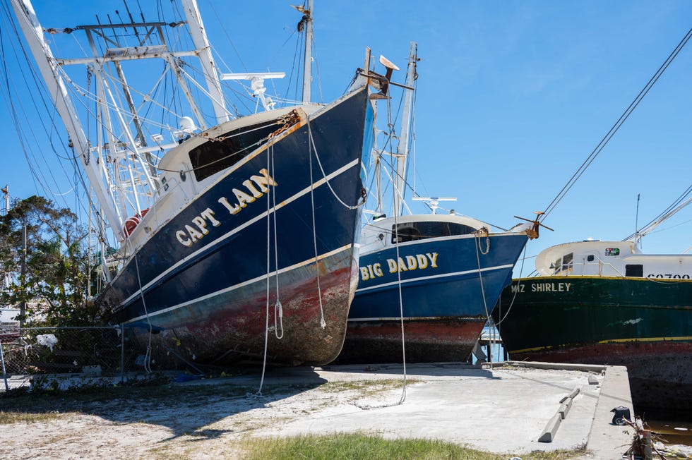 The "Capt Lain", "Big Daddy" and "Miz Shirley" shrimping boats lay in various states of damage near Trico Shrimping Company after Hurricane Ian passed through the region Wednesday afternoon in Fort Myers, FL., on Friday, September 30, 2022.