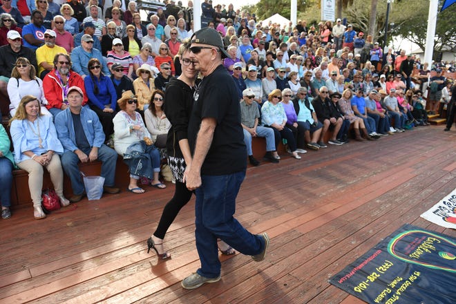 Get funky with the Joey Tenuto Band as they rock the Riverwalk Stage in Stuart this weekend. In this Jan. 20, 2019, photo, a couple dances while Daryl Magill performs.