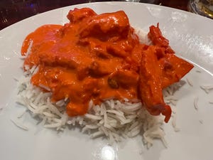 Butter Chicken with moist chunks of chicken anointed with a pepped-up tomato sauce.