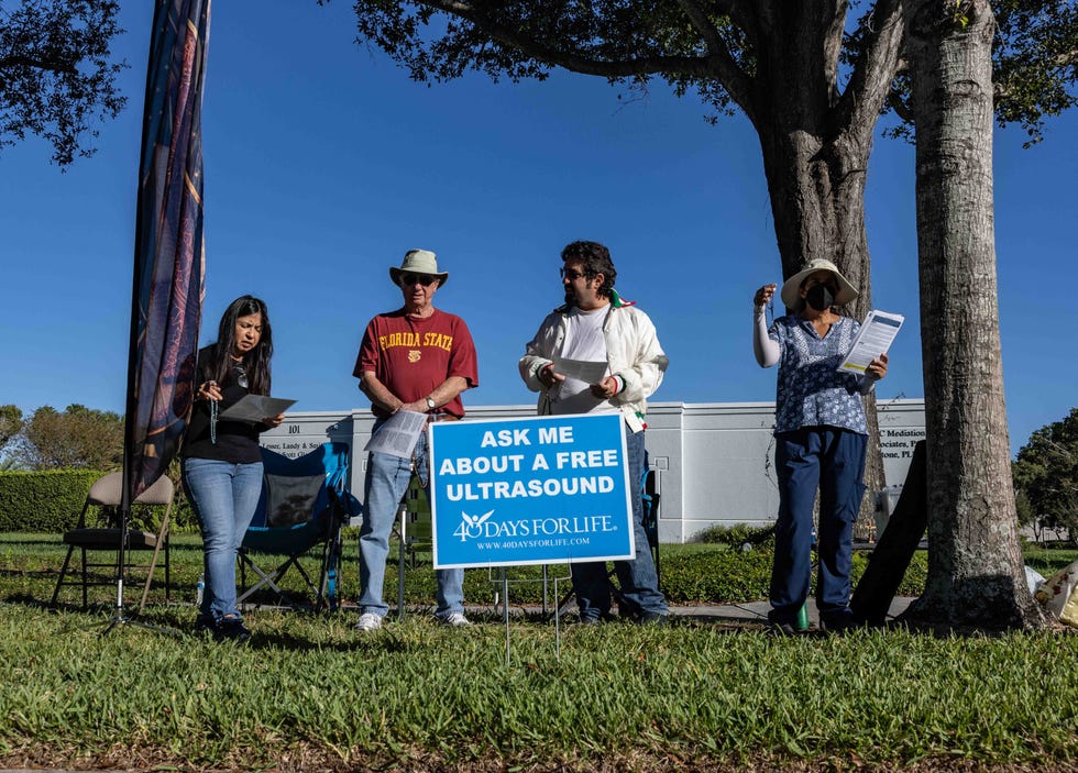 Anti-abortion protesters gather on Northpoint Parkway across from the Presidential Women's Center on a  Saturday in October. One of the protesters said, "We are praying for life. We want to stop the killing of babies."