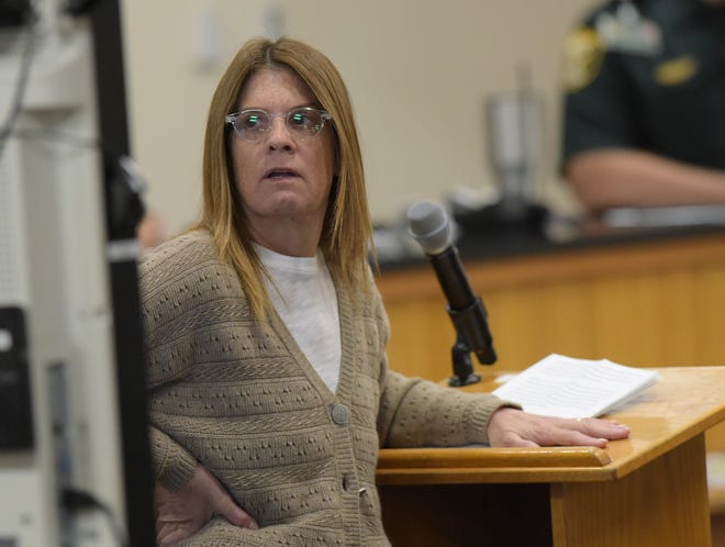 Jodi Bruce, sister of murder victim Michelle Mishcon, comments on a photo of Michelle projected to the court during a court proceeding before Circuit Judge Sherwood Bauer at the Martin County Courthouse on Monday, Nov. 28, 2022 in Stuart.