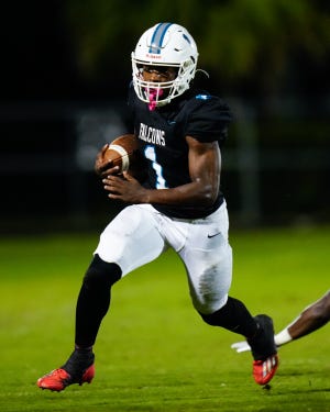 Jensen Beach running back Dennis Palmer (1) runs the ball against Port St. Lucie in a Region 3-3S quarterfinal high school football game, Friday, Nov. 11, 2022, at Jensen Beach High School. Jensen Beach won 51-12.