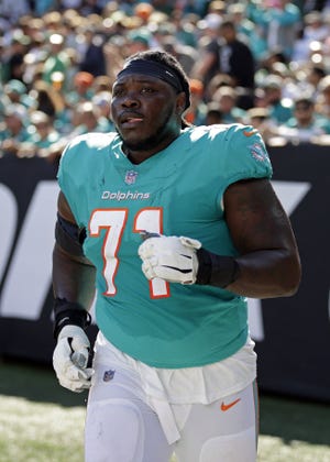Tackle Brandon Shell thought he was done with football before the Dolphins called. Now he's glad to be doing 'what I love.'