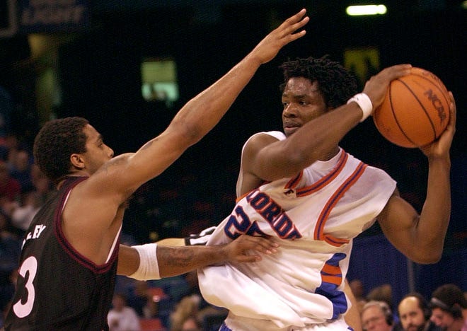 Florida swingman Major Parker tries to keep the ball away from Temple's Quincy Wadley during a second-round NCAA Tournament game at the Louisiana Superdome in March 2001.