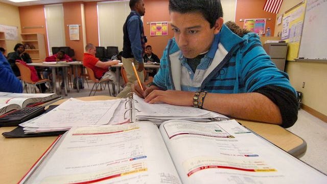 A student works on a series of problems in his Algebra I class at Fort Pierce Central High School.