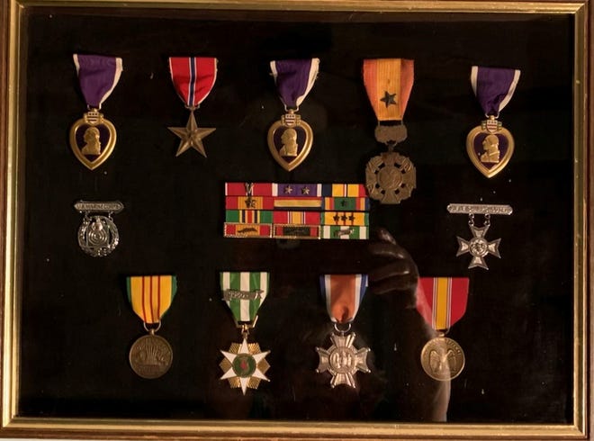 A display case of Jack Simpsons medals, including his three Purple Hearts.