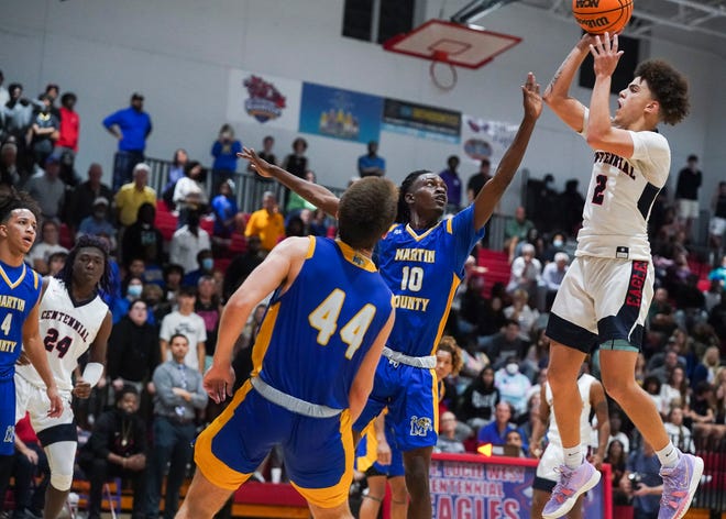 St. Lucie West Centennial's Ty Owens (2) goes for a basket against Martin County in a boys basketball game Wednesday, Jan. 5, 2022, in Port St. Lucie. Centennial won 97-91 in double-overtime.