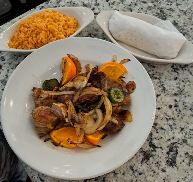 The carnitas michoacanas consisted of slow braised pork sautéed with caramelized onions.