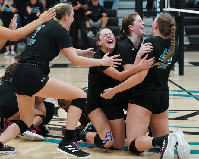 Jensen Beach celebrates winning the 5A state semifinal volleyball match against Vanguard, Saturday, Nov. 5, 2022, at Jensen Beach High School.