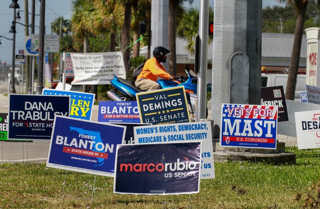 Campaign signs are seen in Monday in Fort Pierce along U.S. 1 at the intersection of Midway Road. Today, voters decide the future course of the nation, state and Treasure Coast as they cast ballots for everything from governor to city council and commission seats. For complete coverage of all the races, check out our election guide at TCPalm.com.