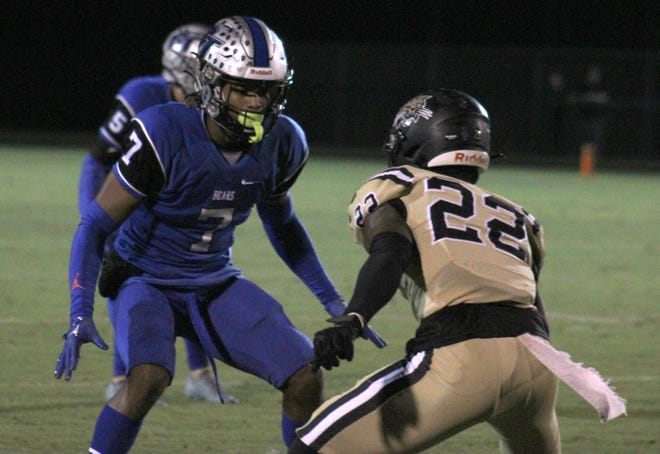 Bartram Trail cornerback Sharif Denson (7) defends Buchholz receiver Jaren Hamilton (22)  during a high school football game on October 21, 2022. [Clayton Freeman/Florida Times-Union]