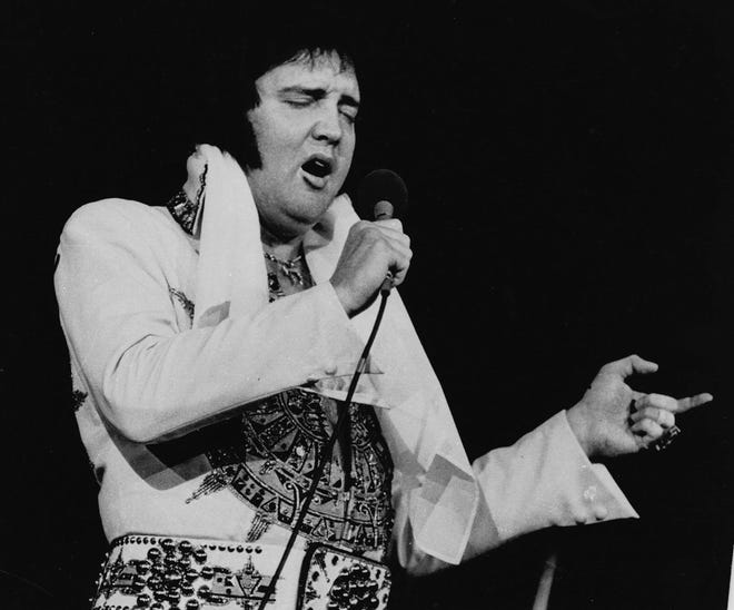 ** FILE ** Elvis Presley is shown performing in Providence, R.I., in this May 23, 1977, file photo. In observance of the 25th anniversary of Presley's death, the Cumberland County Civic Center in Portland, Maine, will present a two-hour musical tribute, ``The Concert That Never Happened,'' on Aug. 17, 2002, featuring Elvis impersonator Jack Smink. Presley, who died Aug. 16, 1977, was scheduled to perform at the Civic Center Aug. 17 and Aug. 18, 1977.  (AP Photo/File)


NY8