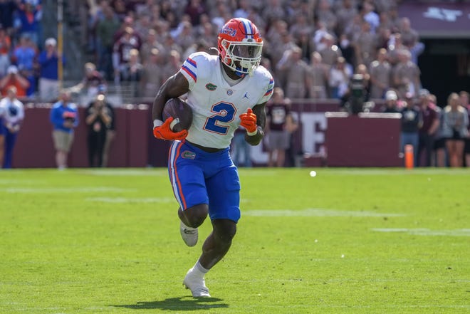 Florida Gators running back Montrell Johnson Jr. (2) runs the ball in the first half Saturday against the Texas A&M Aggies at Kyle Field in College Station, Texas.