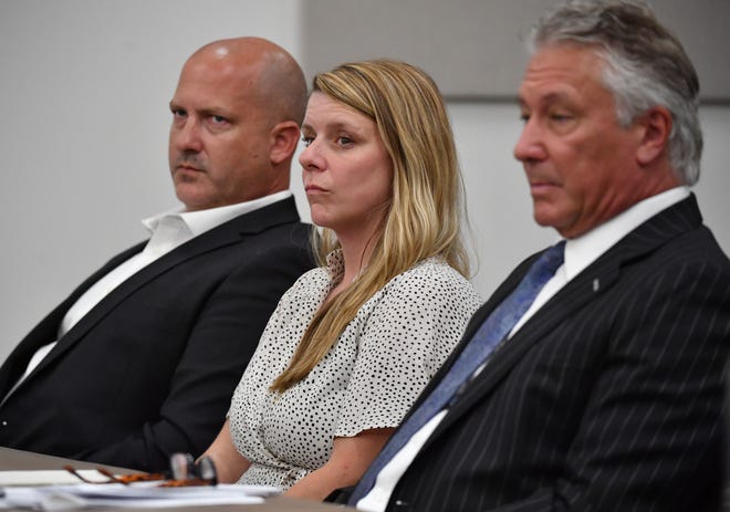 Gabby Petito's parents, Joseph Petito, left, and Nichole Schmidt, center, with their attorney, Patrick Reilly, right, listen to arguments by an attorney for Brian Laundrie's parents, Matthew Luka, as Luka seeks to have a negligence lawsuit dismissed in court in Sarasota County, Florida on Wednesday, June 22, 2022.  Petito and Schmidt claim in their lawsuit that the Laundrie's acted maliciously by not telling them where their daughter was and if she was alive.