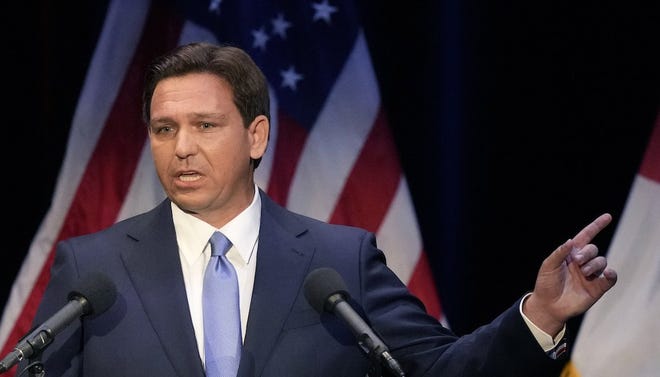 Florida's Republican Gov. Ron DeSantis speaks during a debate against Democratic challenger Charlie Crist, at Sunrise Theatre, Oct. 24, 2022, in Fort Pierce, Fla.