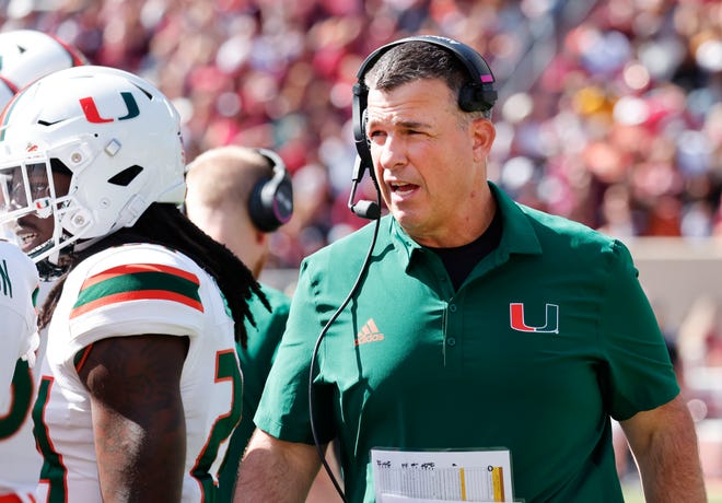 Oct 15, 2022; Blacksburg, Virginia, USA;  Miami Hurricanes head coach Mario Cristobal walks on the sidelines during the second quarter against the Virginia Tech Hokies at Lane Stadium. Mandatory Credit: Reinhold Matay-USA TODAY Sports