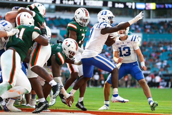 Oct 22, 2022; Miami Gardens, Florida, USA; Duke Blue Devils running back Jordan Waters (7) reacts after scoring a touchdown during the fourth quarter against the Miami Hurricanes at Hard Rock Stadium. Mandatory Credit: Sam Navarro-USA TODAY Sports