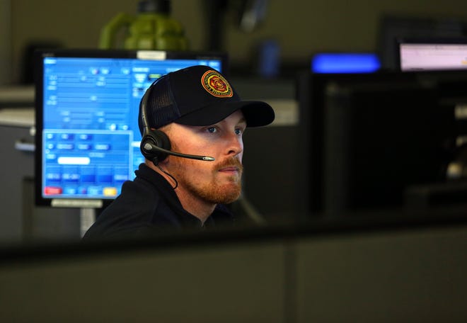 Brandon Lake, of the St. Lucie Fire District, works out of the St. Lucie County Emergency Operations Center in Fort Pierce on Thursday, Nov. 17, 2022.
