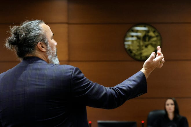 Manuel Oliver gives the middle finger to the defense team during his victim impact statement during the sentencing hearing for Marjory Stoneman Douglas High School shooter Nikolas Cruz at the Broward County Courthouse in Fort Lauderdale on Wednesday, Nov. 2, 2022. Oliver’s son, Joaquin Oliver, was killed in the 2018 shootings.
