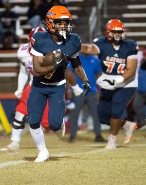 Escambia running back Keimani Turner (No. 7) looks for a place to run during Friday night's District 1-3S matchup against the Pine Forest Eagles.