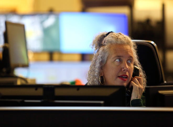 Amber Jefferson, assistant supervisor of the St. Lucie County Emergency Operations Center in Fort Pierce, answers calls coming through to the center on Thursday, Nov. 17, 2022, in Fort Pierce.