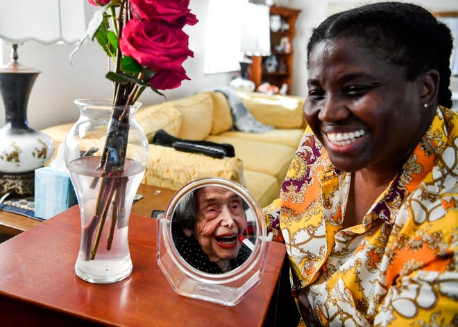 Caregiver Beverly Tucker has her photograph taken with Louise Carnevale, a Stuart woman who just turned 108, Wednesday, Nov. 16, 2022, at Kingswood. Carnevale is known for her volunteerism, environmental stewardship and activism in Martin County. Tucker is one of three caregivers that work around the clock to keep Carnevale safe and happy.