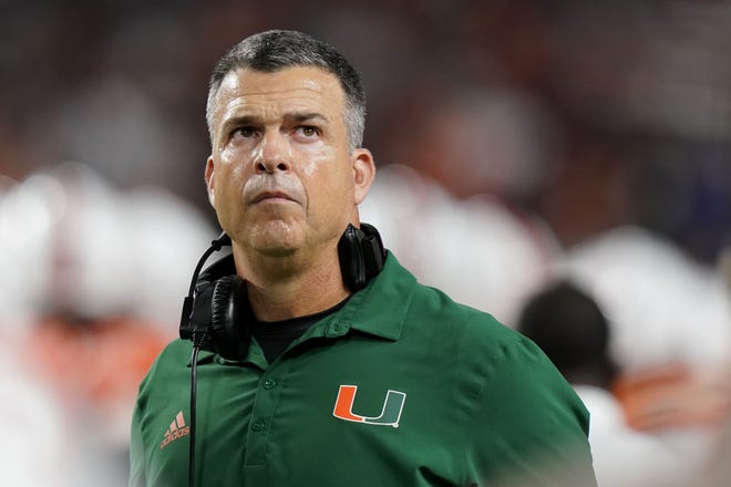 Miami head coach Mario Cristobal watches during the first half of an NCAA college football game against Florida State, Saturday, Nov. 5, 2022, in Miami Gardens, Fla.(AP Photo/Lynne Sladky)
