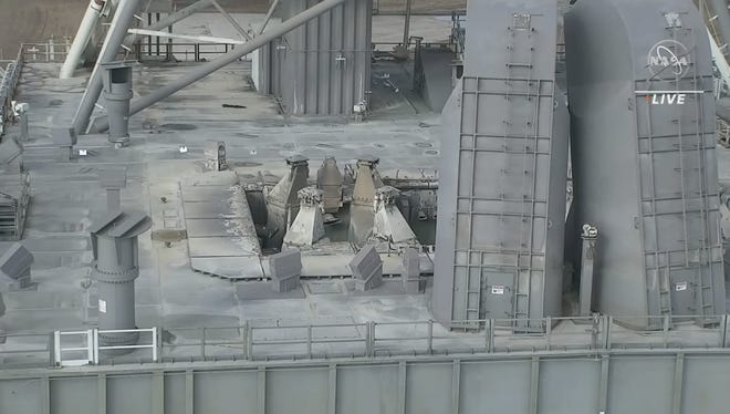 A video screenshot shows slight damage to the main deck of the mobile launcher at Kennedy Space Center after the Artemis I mission launched on Nov. 16, 2022.