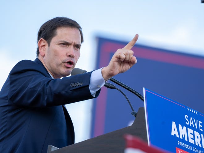 Rally goers, 45th President Donald Trump and Marco Rubio are seen at the Save America Rally at the Miami Dade County Fair and Expo in Miami on Sunday November 6, 2022.