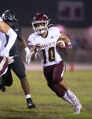 Deangelo Shorts (10) carries the ball during the Niceville vs Navarre football game at Navarre High School on Friday, Nov. 4, 2022.
