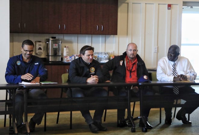 Florida Gov. Ron DeSantis visits the Volusia County Beach Safety Building Friday and meets with local officials. The governor also toured damage left by Tropical Storm Nicole.