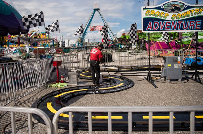 Carnival operator Doolan Amusements sets up for the Fall Fun Fest outside the Port St. Lucie Civic Center, now known as the MIDFLORIDA Credit Union Event Center, on Wednesday, Oct. 24, 2018, in Port St. Lucie.