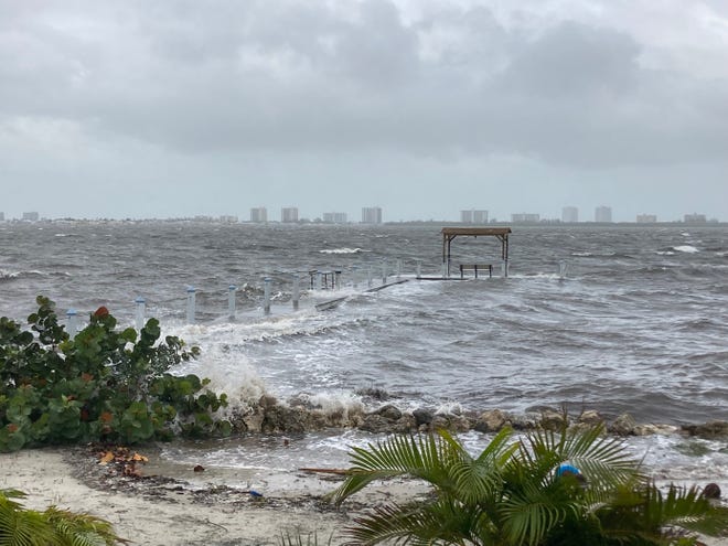 Waves crash over a dock Nov. 9 in 13800 block of South Indian River Drive before Tropical Storm Nicole.