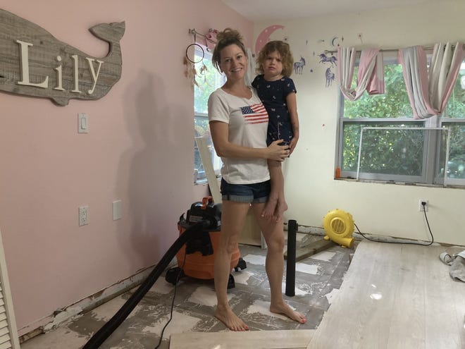 Ashley Maytin (left), and daughter, Luna (right), on Nov. 11, 2022, in a room Luna, 4, shares with her 6-year-old sister, Liliana. Hurricane Nicole brought several inches of water into the room of their home south of the Palm City Bridge, at the east end of Southwest 31st Street in Martin County.