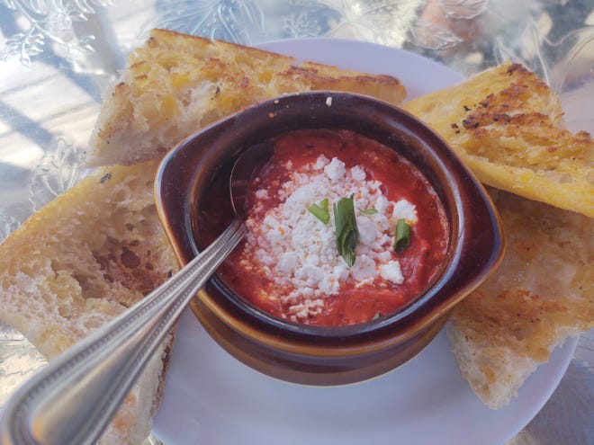Hot, gooey marinara goat cheese dip with large hunks of crunchy toasted bread is perfect for sharing.