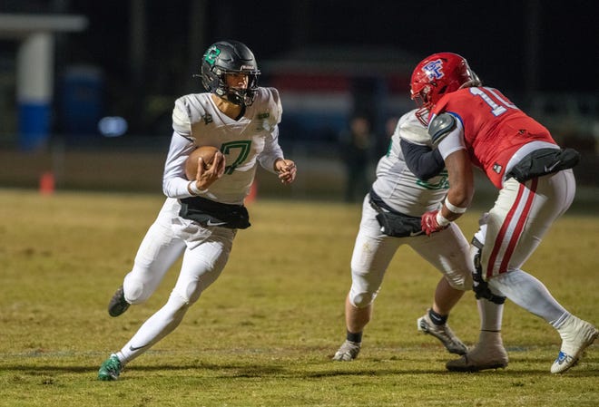 Choctawhatchee quarterback Jesse Winslette runs downfield during the FHSAA State Championship playoff game at Pine Forest High School on Nov. 18. Chocktaw went on to defeat Pine Forest 30-29.
