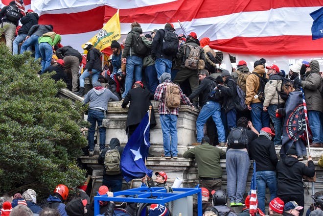 Supporters of then-President Donald Trump flood the U.S. Capitol grounds in Washington on Wednesday, Jan. 6, 2021.