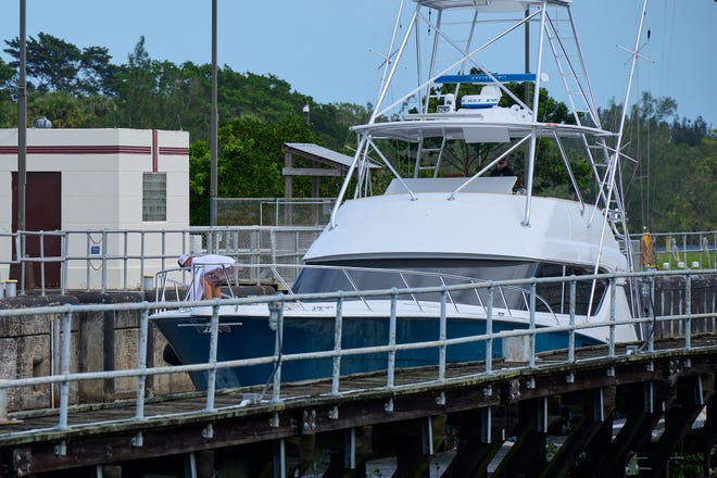 A sportfishing boat motors from the St. Lucie Locks on Nov. 8, 2022 ahead of Tropical Storm Nicole's arrival.