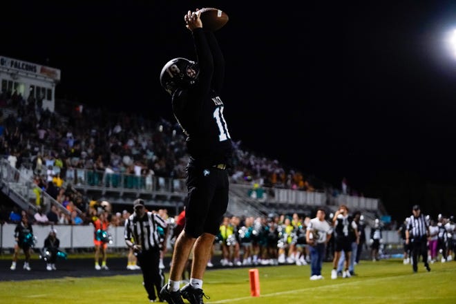 Jensen Beach’s running back Dylan Fatovich (18) catches a pass to score a touchdown against Martin County in a high school football game on Thursday, Nov. 3, 2022, at Jensen Beach High School.