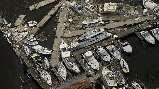 FILE PHOTO A variety of boats rest in a heap at the mangled Fort Pierce Marina on Sept. 6, 2004, after Hurricane Frances blew through the city and the rest of the Treasure Coast.