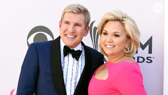 FILE - Todd Chrisley, left, and his wife, Julie Chrisley, pose for photos at the 52nd annual Academy of Country Music Awards on April 2, 2017, in Las Vegas. The couple, stars of the reality television show “Chrisley Knows Best,” have been found guilty in Atlanta on federal charges including bank fraud and tax evasion Tuesday, June 7, 2022.
