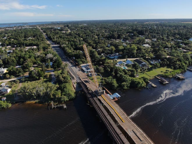Looking southeast over the St. Sebastian River, the Florida East Coast railroad bridge and a temporary one (right) Brightline contractors will use to erect a new one are shown Dec. 26, 2020. The new bridge between Roseland in Indian River County and Little Hollywood in Brevard County will give Brightline two rails of track to connect Miami and Orlando.