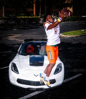 Shawn Russ, Dunbar, No. 5 recruit in the Naples Daily News and The News-Press'  Big 15 for 2022. Corvette Stingray courtesy Larry Crowley of Crowley Construction.