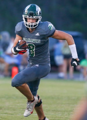 South Walton WR Pearce Spurlin picks up yards after a reception as the Seahawks hosted the Walton Braves in a county rivalry football game.