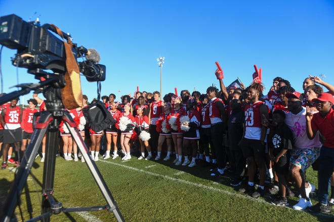 The Vero Beach High School football team and cheerleaders gather around for a live segment broadcast on the Today Show called the Friday Morning Lights at Billy Livings Field in Vero Beach on Friday, Oct. 7, 2022.