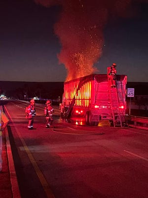 A trailer carrying construction debris caught fire off Oslo Road east of 58th Avenue leading to a roughly five-hour partial closure of the highway on Thursday, October 27, 2022, according to fire and law enforcement officials.