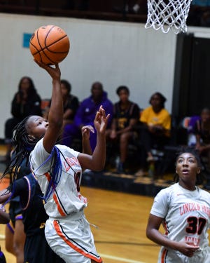 Lincoln Park Academy's Ta'tyannah Thompson (10) goes for a layup in the girls Greyhound Holiday Classic basketball final against Fort Pierce Central on Tuesday, Dec. 20, 2022, in Fort Pierce. Lincoln Park Academy won 50-36.
