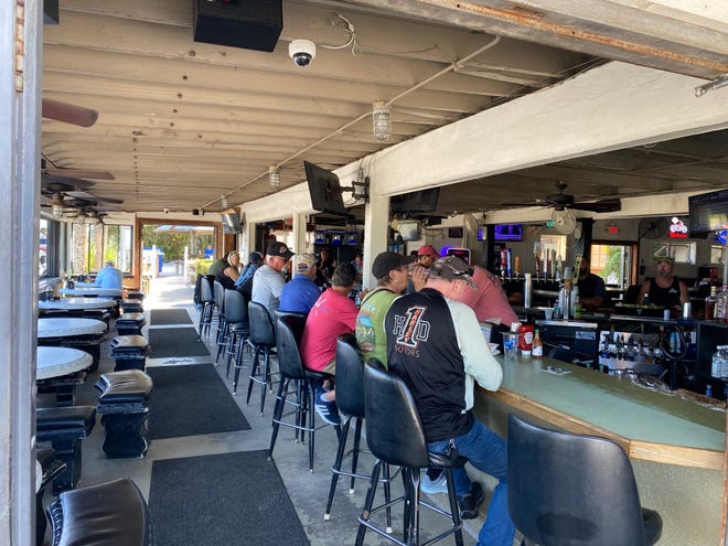 Earl's Hideaway Lounge, a hotspot biker bar in Sebastian on Indian River Drive overlooking the Indian River Lagoon,  will soon be sold. About a dozen customers gather there Tuesday, Nov. 29, 2022.