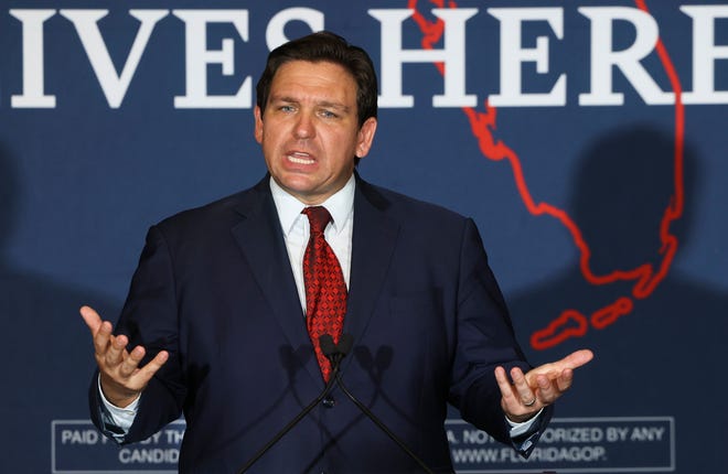 FILE - Florida Gov. Ron DeSantis speaks to a crowd of supporters during the Keep Florida Free Tour on Wednesday, Aug. 24, 2022, in Tampa, Fla. DeSantis on Wednesday, Sept. 14 flew two planes of immigrants to Martha's Vineyard, escalating a tactic by Republican governors to draw attention to what they consider to be the Biden administration's failed border policies.  (Luis Santana/Tampa Bay Times via AP, File)